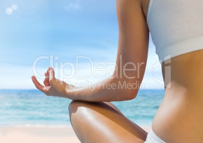 Woman Meditating by sea