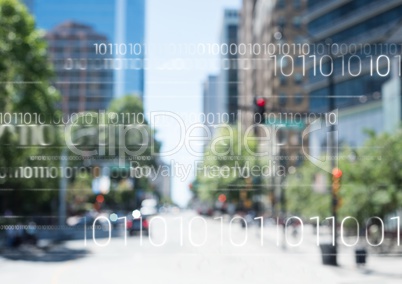 White binary code against blurry street