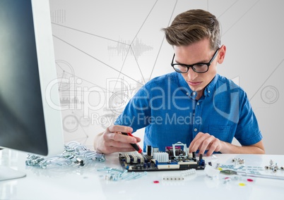 Man with electronics against white background with graphs