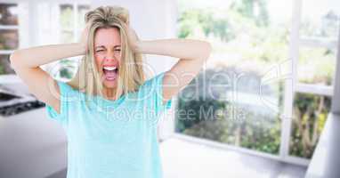 Stressed woman by glass doors at home