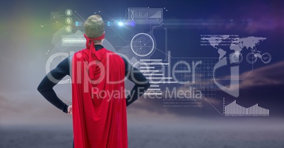 Man dressed up as superhero standing in front of futuristic interface