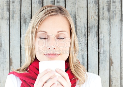 Woman with white mug against wood panel