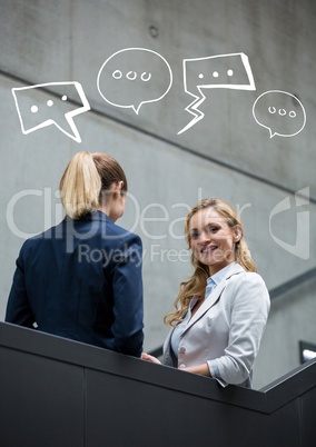 Business women on stairs with white speech bubbles