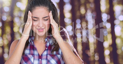 Stressed woman headache in forest trees