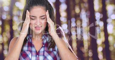 Stressed woman headache in forest trees