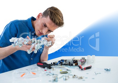 Man with electronics against white background with blue wave