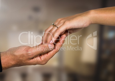 Wedding engaged couple holding hands with blurred background