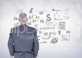 Businessman with business graphics drawings