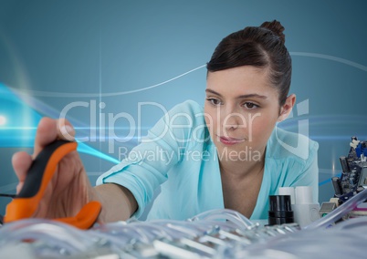 Woman with electronics and pliers against blue background with waves