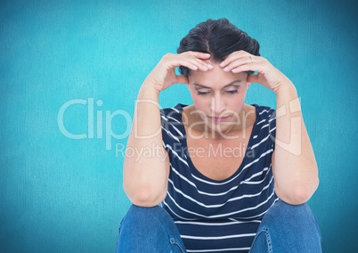 Depressed stressed woman against blue background