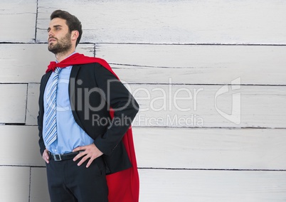 Business Superhero against wood