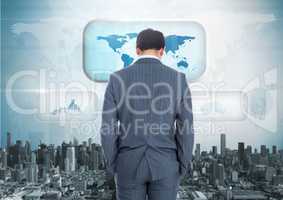 Businessman looking at City with world map interface
