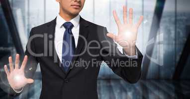Business man mid section with flares on hands against blurry window