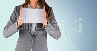Business woman torso with blank card against blue background