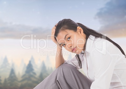 Tired disappointed young woman against magical sky