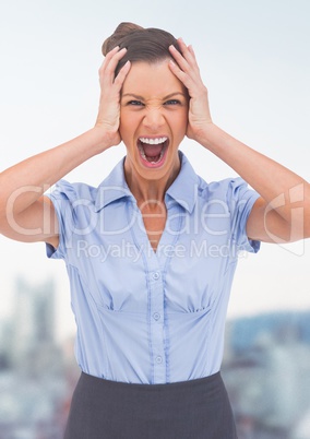 Stressed woman screaming in front of city background