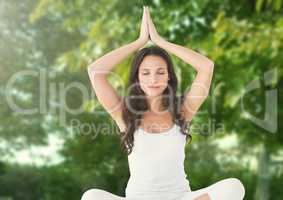 Woman Meditating yoga by trees