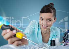 Woman with electronics and screwdriver against blue background with waves