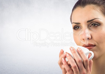 Close up of woman with white mug against white wall