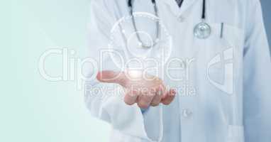 Doctor mid section with white interface and flare on hand against blue background