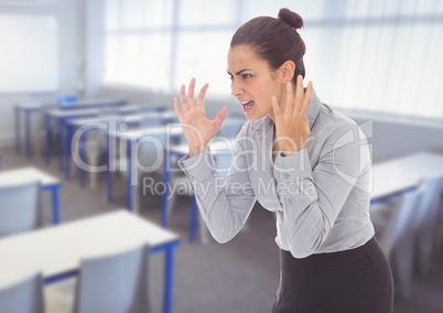 Stressed woman shouting in classroom