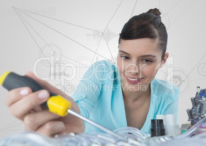 Woman with electronics and screwdriver against white background with graphs