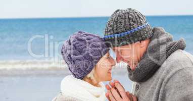 Elderly couple against blurry beach