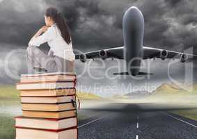 Business woman sitting on Books stacked by plane take off runway