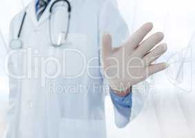 Doctor mid section with hand out against blurry window