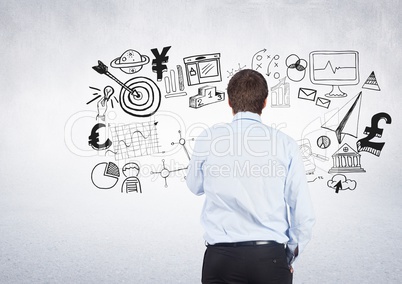 Businessman with business graphics drawings