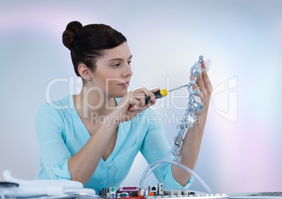 Woman with electronics against blurry background
