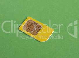 phone sim card over green with copy space