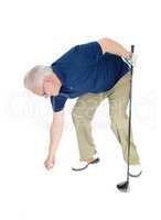 Senior man pleasing his golf ball.