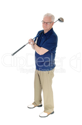 Senior practicing golf at home.