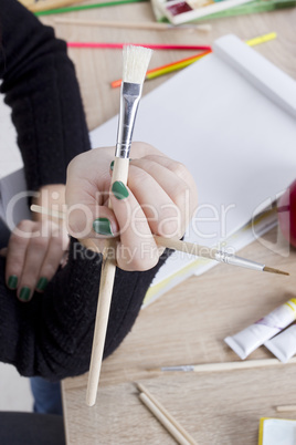 Artist with brushes for drawing
