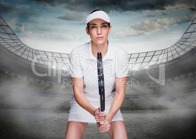 Tennis player in stadium with bright lights and sky with clouds