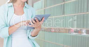 Woman on tablet in Library