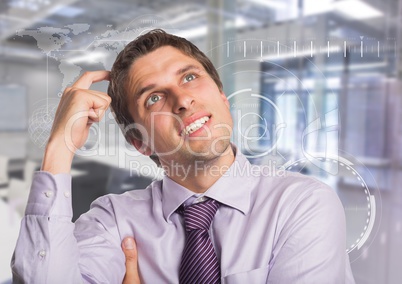 Man in lavendar shirt scratching head against white interface and blurry room