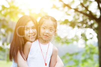 Asian mom and daughter portrait.
