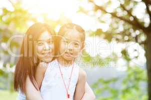 Asian mom and daughter portrait.