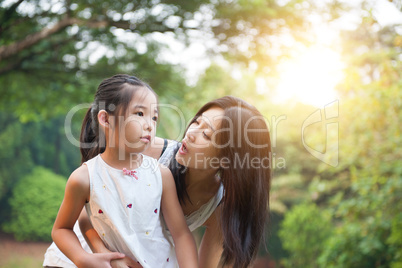 Mother and daughters at outdoors.