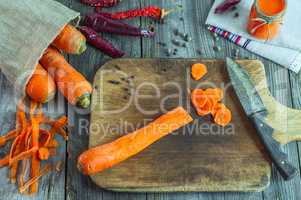 Sliced peeled carrots on a kitchen cutting board