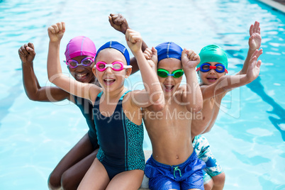 Cheerful children enjoying at poolside