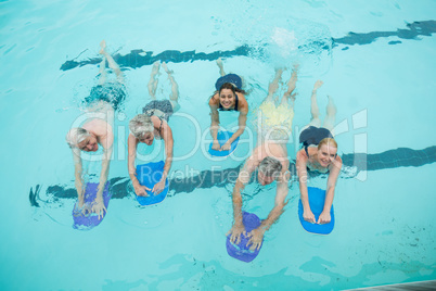 Senior swimmers swimming in pool