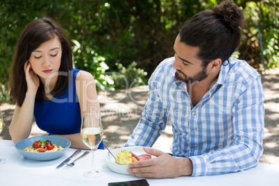 Couple having relationship difficulties at restaurant
