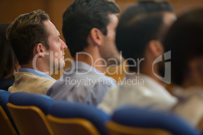 Business executives listening to speech