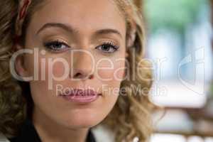 Portrait of beautiful young woman in coffee shop