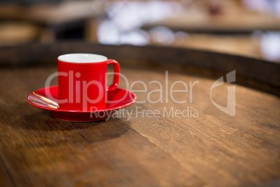 Close-up of red cup and saucer on table