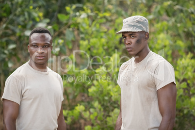 Military soldiers standing together during obstacle course