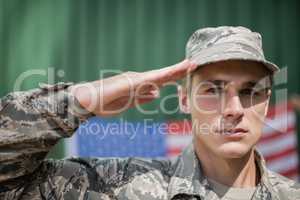 Portrait of military soldier giving salute